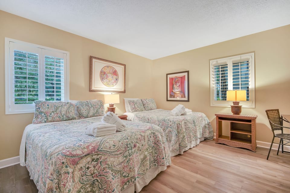 Bedroom 2 - two double beds with flat screen tv.