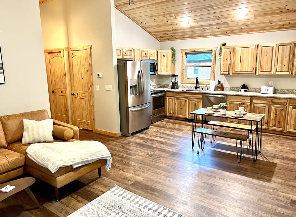 Living room into kitchen view. Perfect for the chef while the others cozy up.