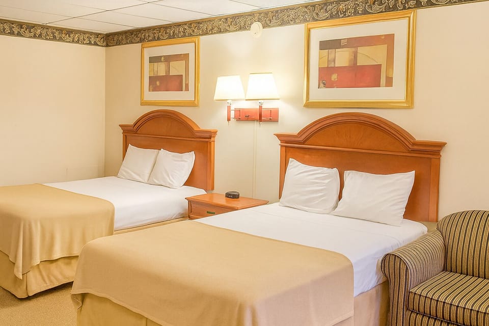Step into a welcoming room with two comfy beds.