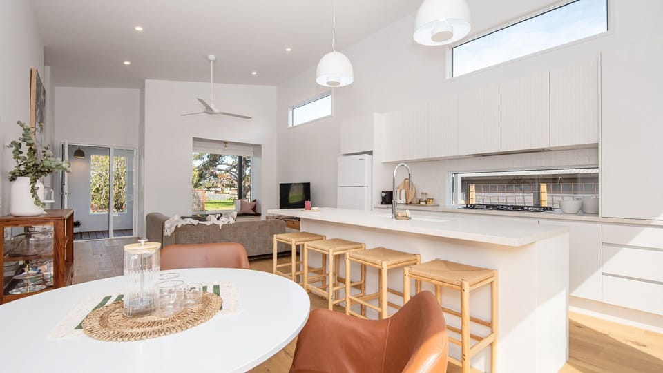 Modern light and bright living space with smart tv and fully equipped kitchen 