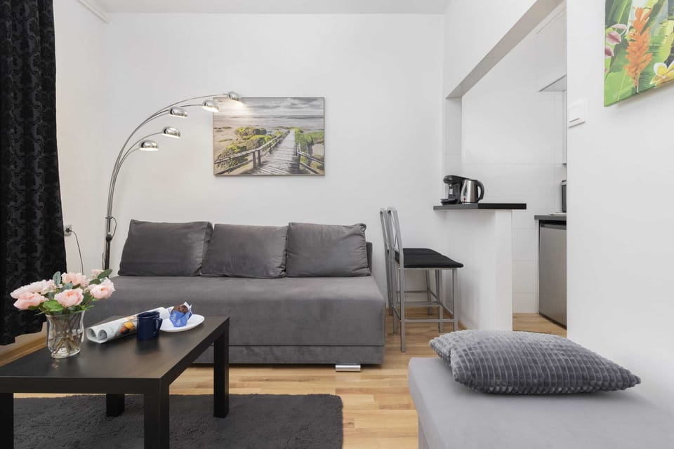 Another perspective of the living space, emphasizing its connection to the dining area and its open layout.
