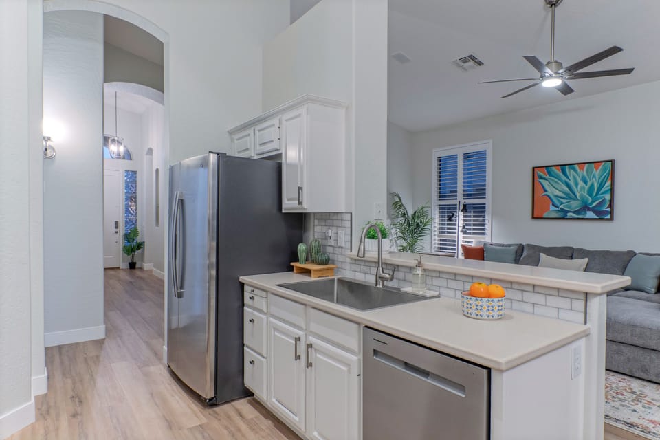 Kitchen opens into great room for easy transfer of food and drinks.
