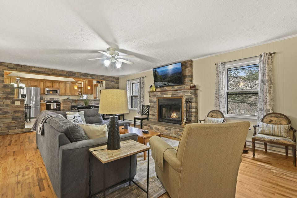 Large screen TV over stone fireplace 