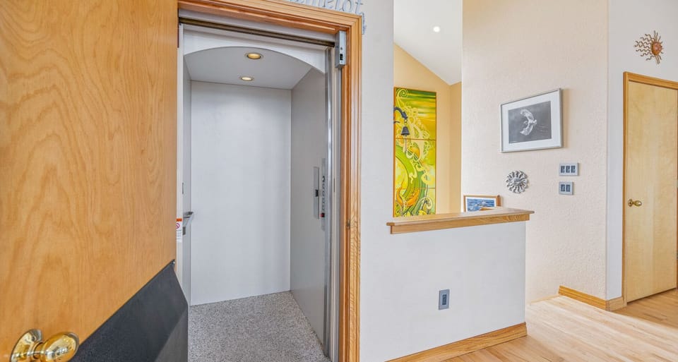 Surf or Sound Realty - 1072 - Camelot - Elevator - Label