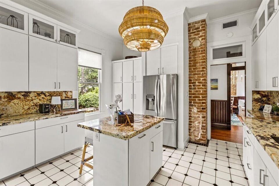 Modern elegance meets rustic charm with a granite island and bright airy vibes! 