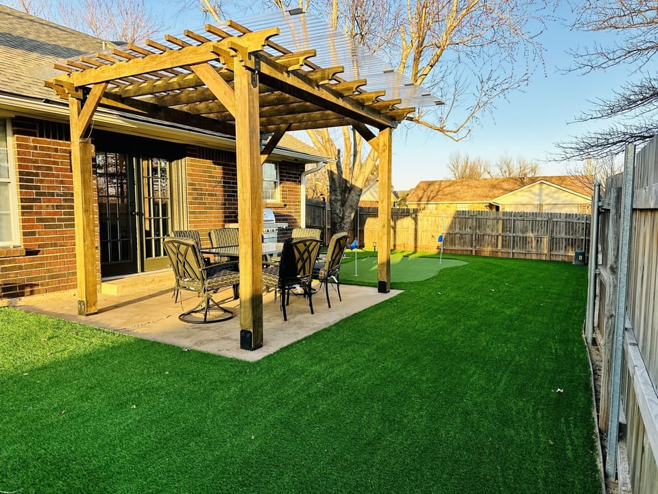 An outdoor space to die for! 3 hole golf, turf, gas grill, and covered pergola!