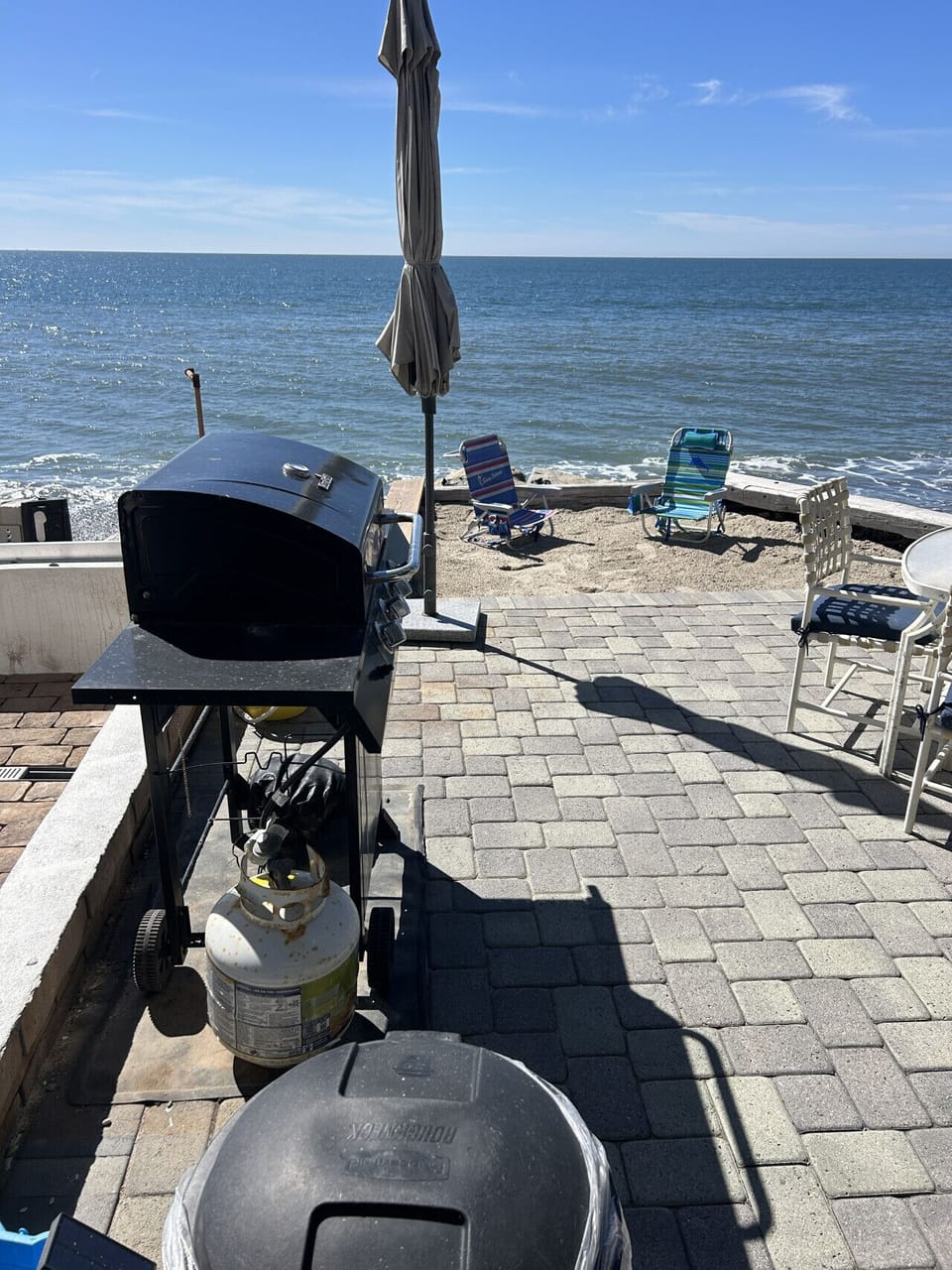 BBQ & small beach area at patio level