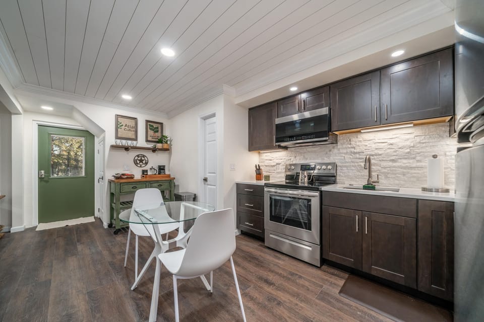 Large Kitchen with quartz countertops and stainless steel appliances. 