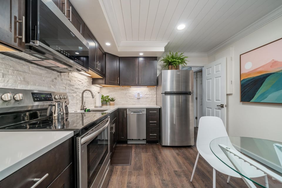 Kitchen is stocked with Pots, pans, dishes, appliances, silverware, cutlery!