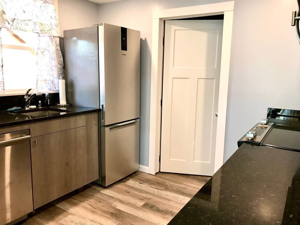 Designer kitchen: dishwasher, refrigerator, stove/oven, microwave, washer/dryer