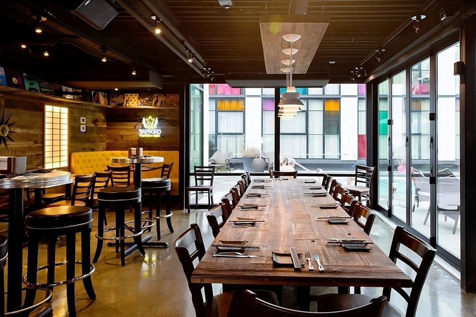 Savor long dinners at the communal table in warm light.