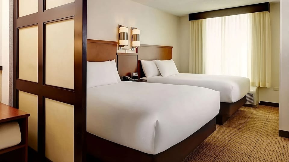 Settle into a bright, spacious room with two plush beds.