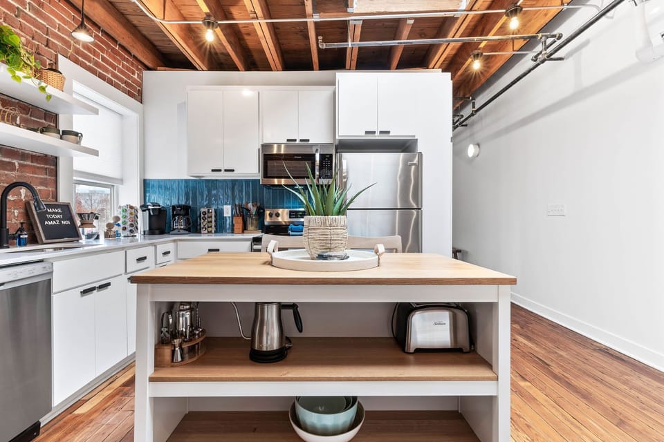 Beautifully updated and fully stocked kitchen that includes limited spices, all pots and pans needed for cooking and a full coffee bar. 