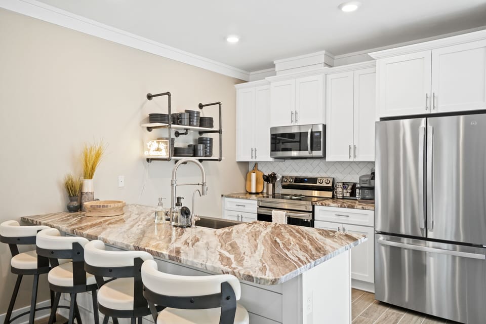 Fully equipped kitchen with granite countertops.