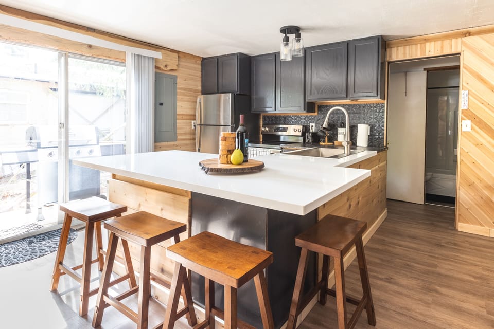 Open kitchen stocked with what you need to cook your meals in this cabin.