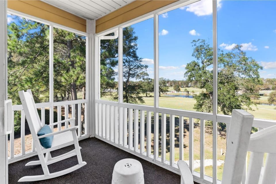 Screened in porch overlooking the 18th hole and Calabash creek. 