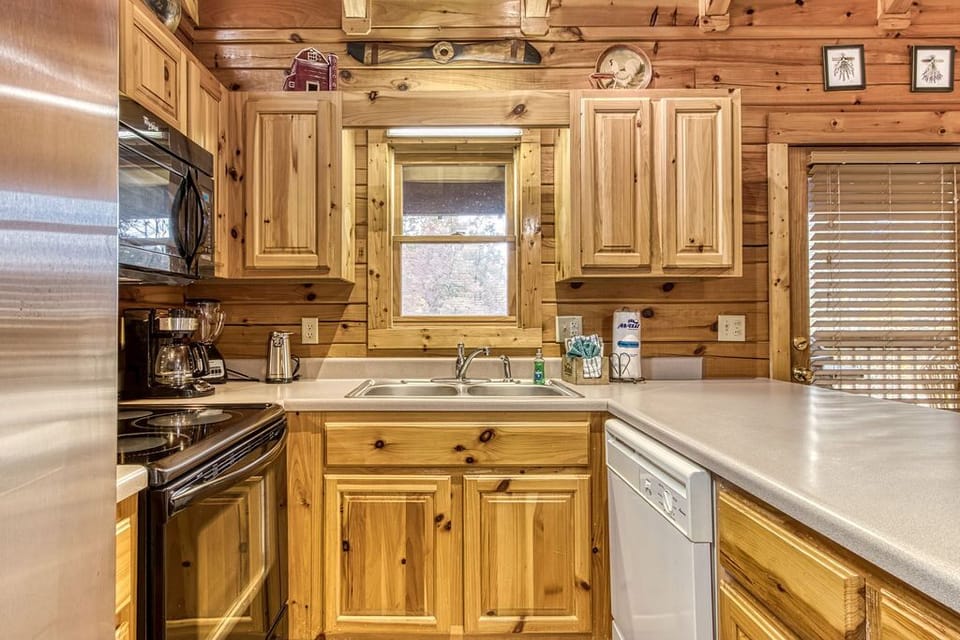 Convenience! Full fridge, oven, microwave, dishwasher, dishes, pots and pans.