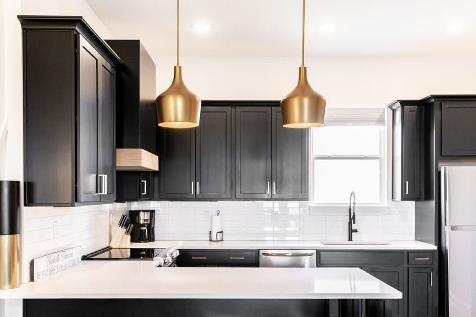 Bright, fully-equipped kitchen with seating for 4 at the counter plus a dining table with seating for 6. Opens up into the living room.