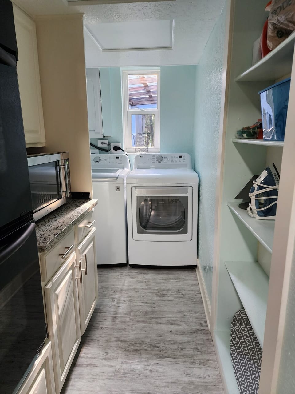 Newer washer and dryer inside of the home.
