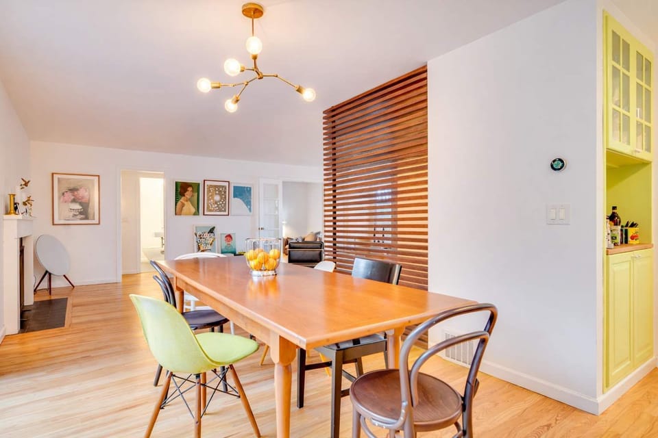 Spacious dining area with a beautiful wood table and stylish seating—perfect for shared meals and great conversations.