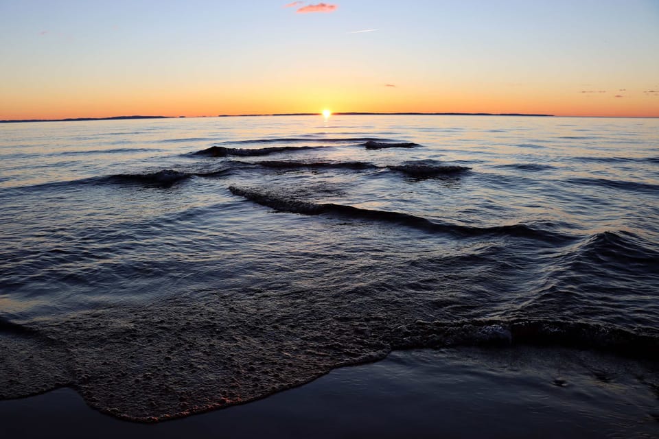 Lake Superior sunrises from your private beach — the kind of morning view that makes you set an alarm on vacation
