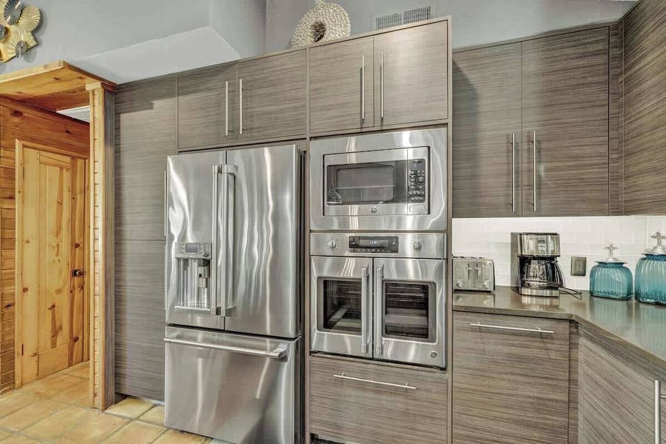 Top-of-the-line stainless steel appliances make preparing a meal easy and enjoyable for the whole family.