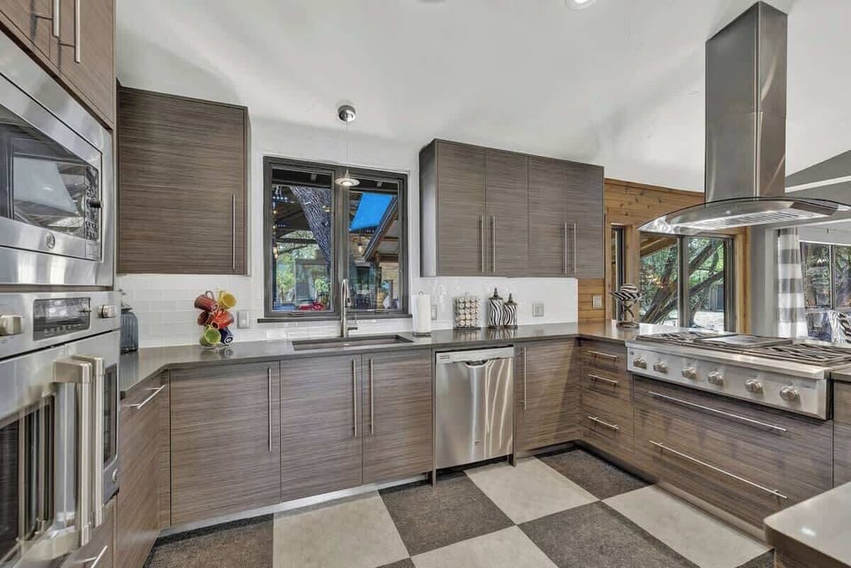 It's clear that this is a top-of-the-line kitchen, perfect for anyone who loves to cook. The spacious new appliances provide ample storage and cooking space, making meal prep and cleanup a breeze.