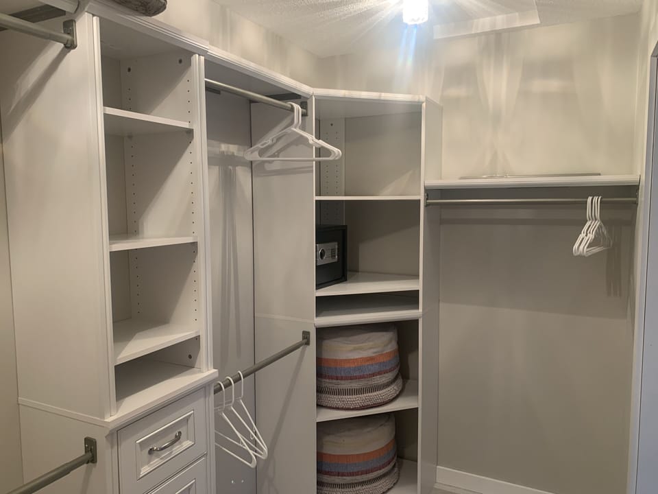 Primary walk-in closet. 