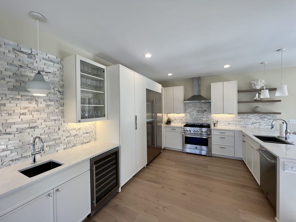 View of gourmet kitchen and full wet bar