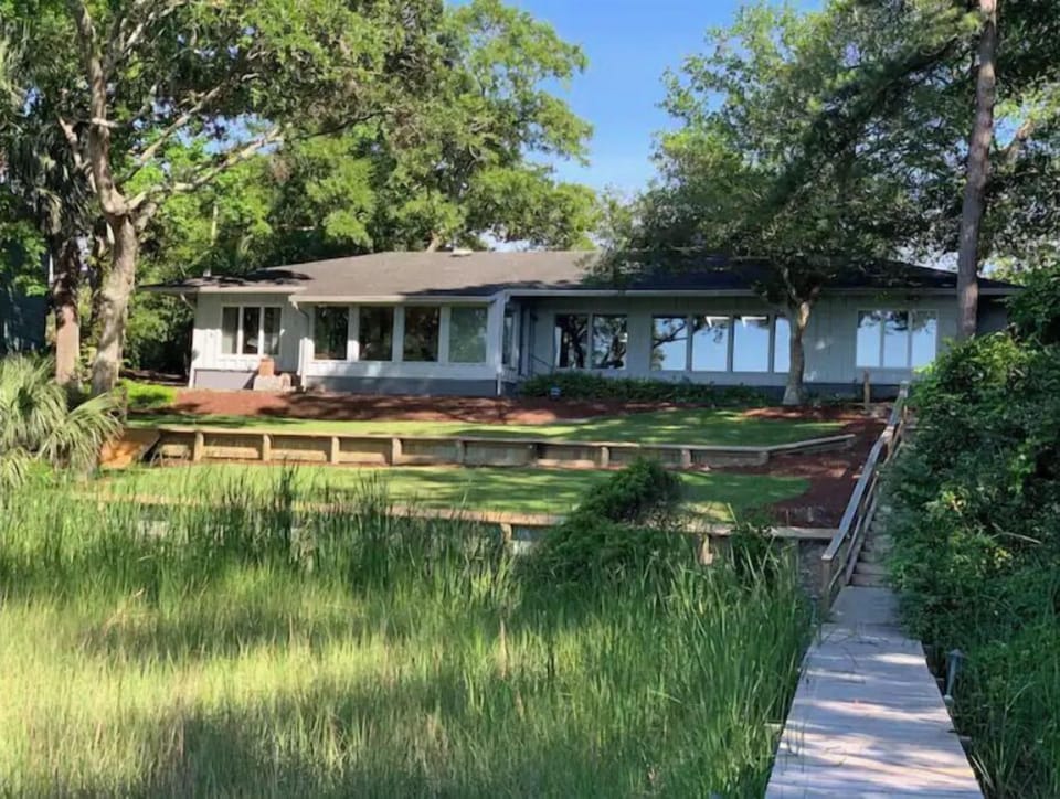 view of the back of the house with dock walkway