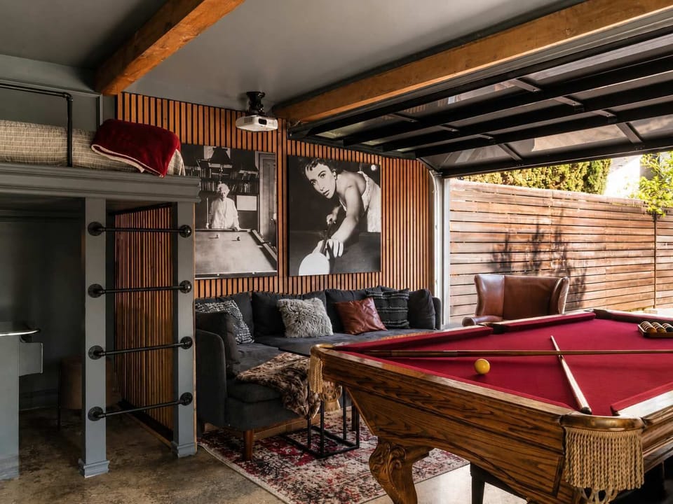 [Game room] Lounging area, pool table, arcade & loft queen bed.