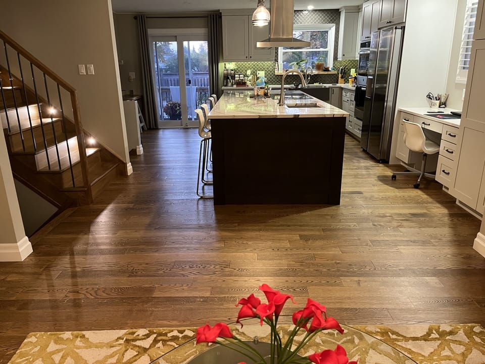 Open concept large kitchen looking at pool in backyard