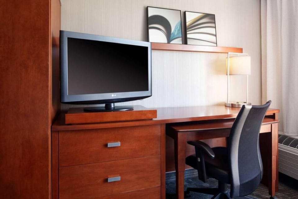 Catch up on work at the desk with in-room TV.