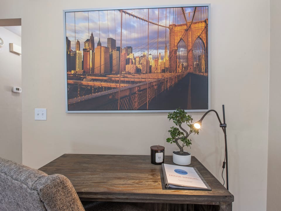 Office area with light. House manual on folder.