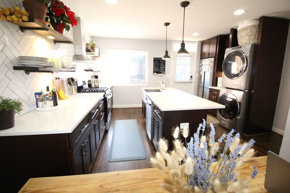 Fully stocked chef's kitchen includes full size washer and gas dryer.