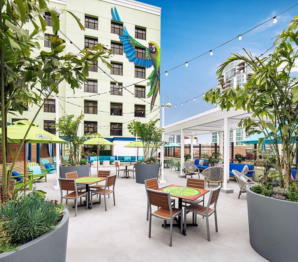 Gather outdoors for sunny chats amid lush planters and seating.