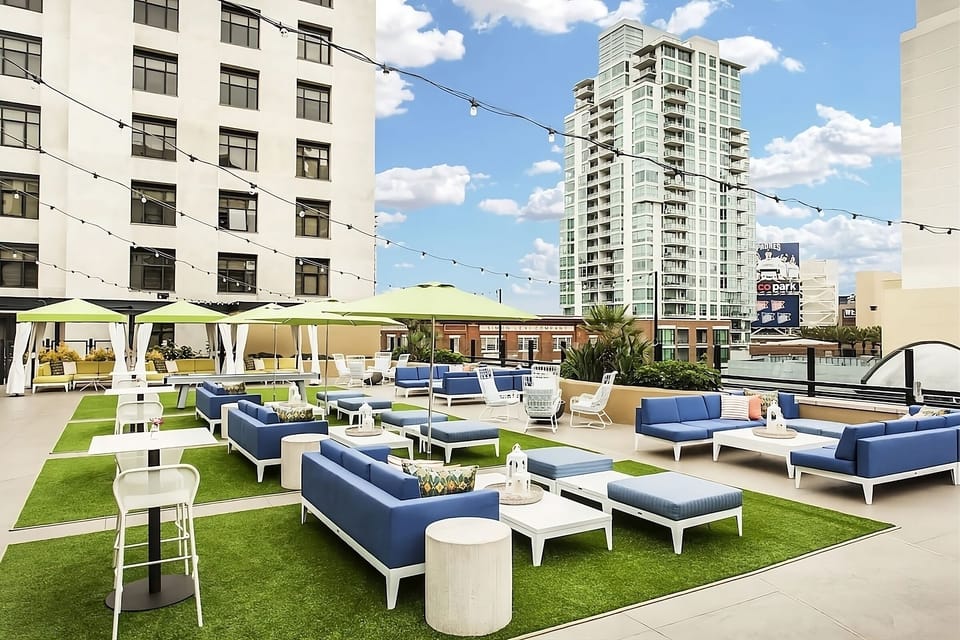 Stretch out on the rooftop lounge with breezy city energy.