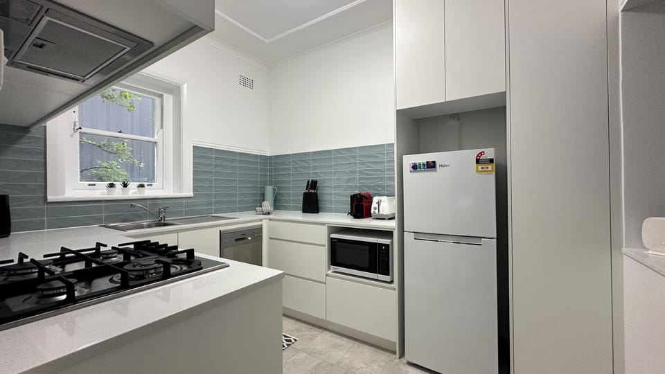 Brand new kitchen with dishwasher, oven, stove, microwave and refridgerator