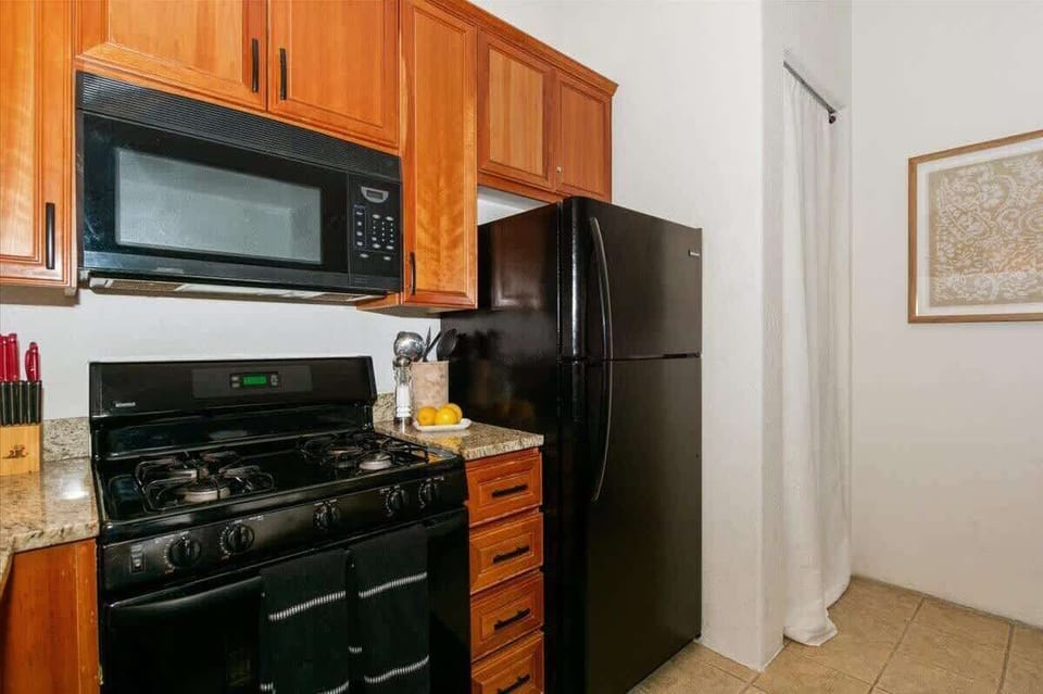 Kitchen w/ Refrigerator/Freezer and Built-In Microwave