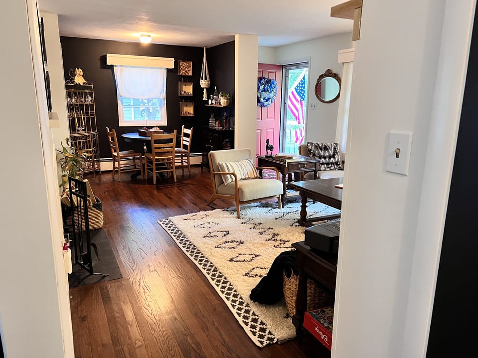 Front living Room with a cozy card or beverage area. 