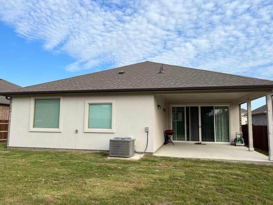 Spacious covered patio with dining table/chairs and BBQ grill provided.  