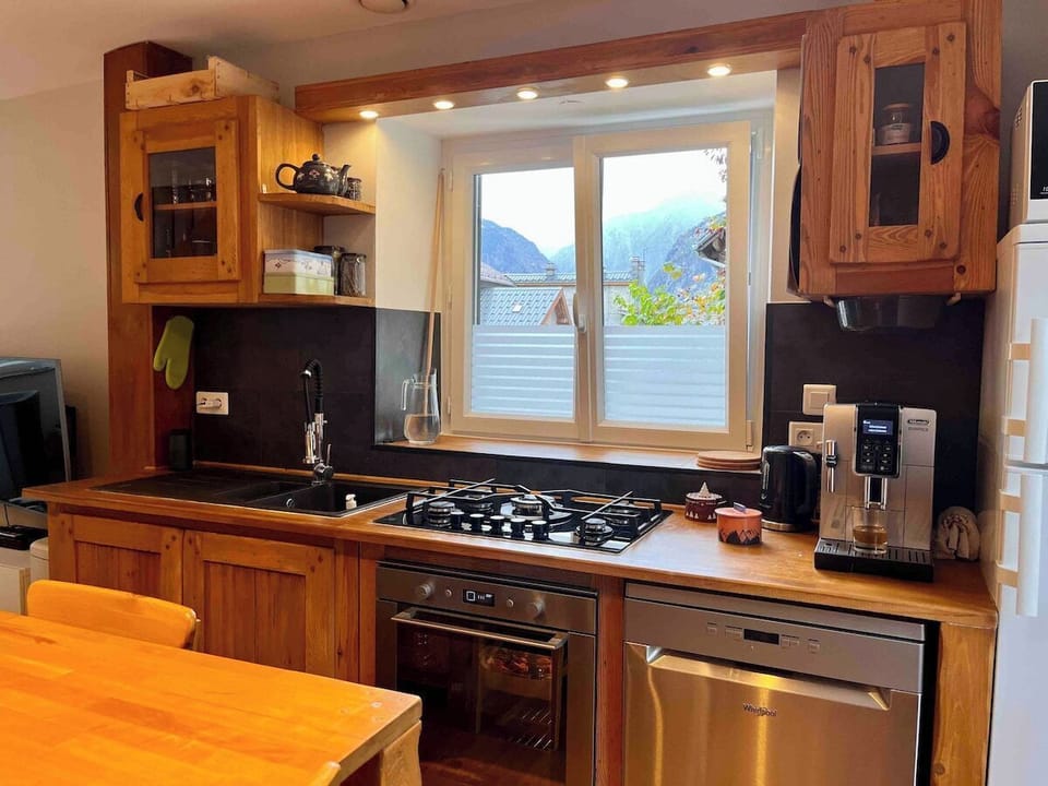 The kitchen  has hob oven microwave, fridge freezer and dishwasher