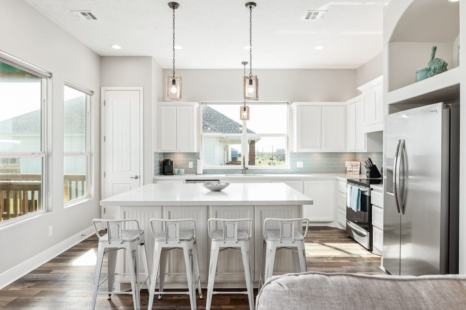 Sit up at the breakfast bar and keep the chef company