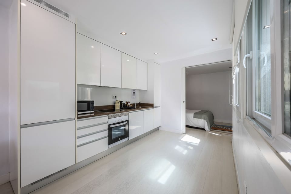 View of the kitchen area with appliances