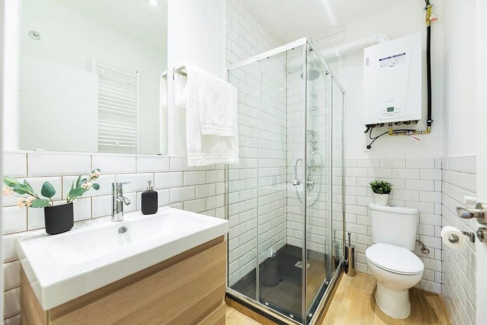 View of one of the bathrooms with a shower tray
