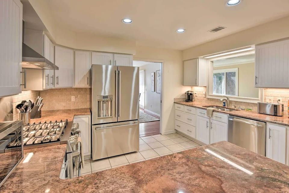 Large kitchen with window into the Office /sunroom 