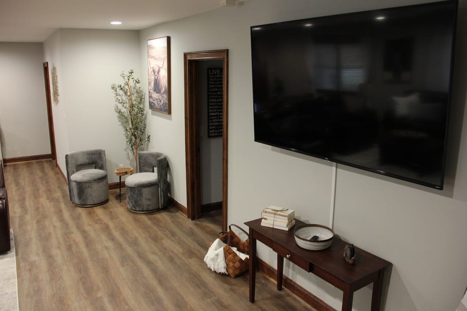 The living room has a 75" TV and YouTubeTV to watch your favorite show or game!