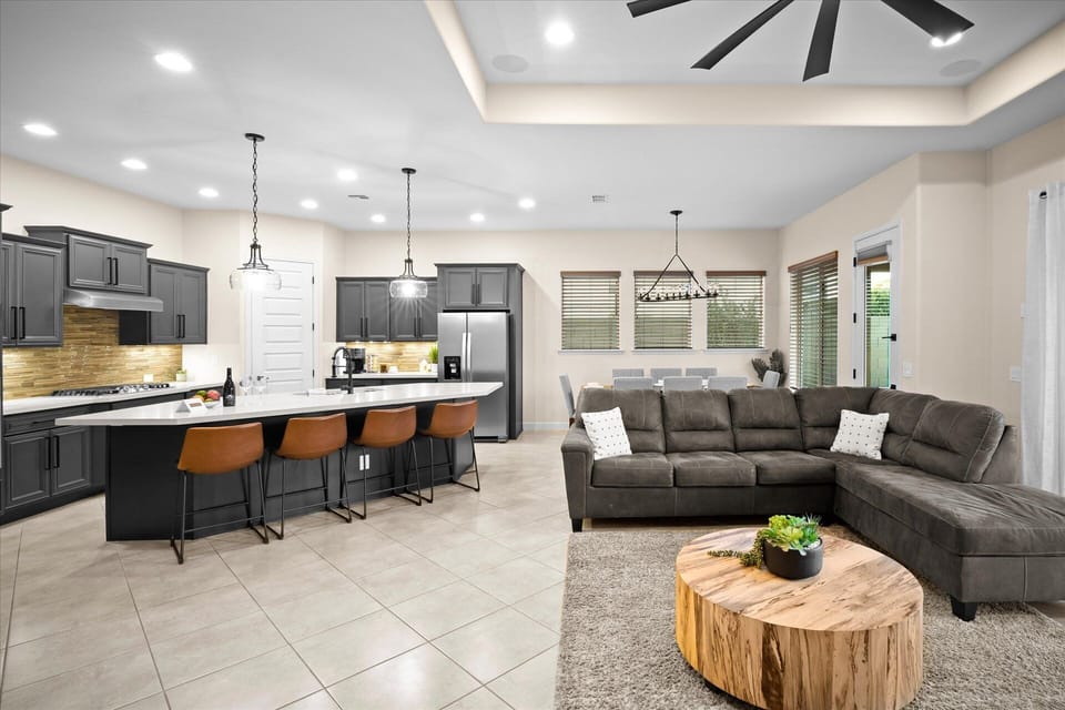 Kitchen & Living Room | Seamless Open Floor Plan Enjoy a modern kitchen and cozy living area, perfect for group gatherings.