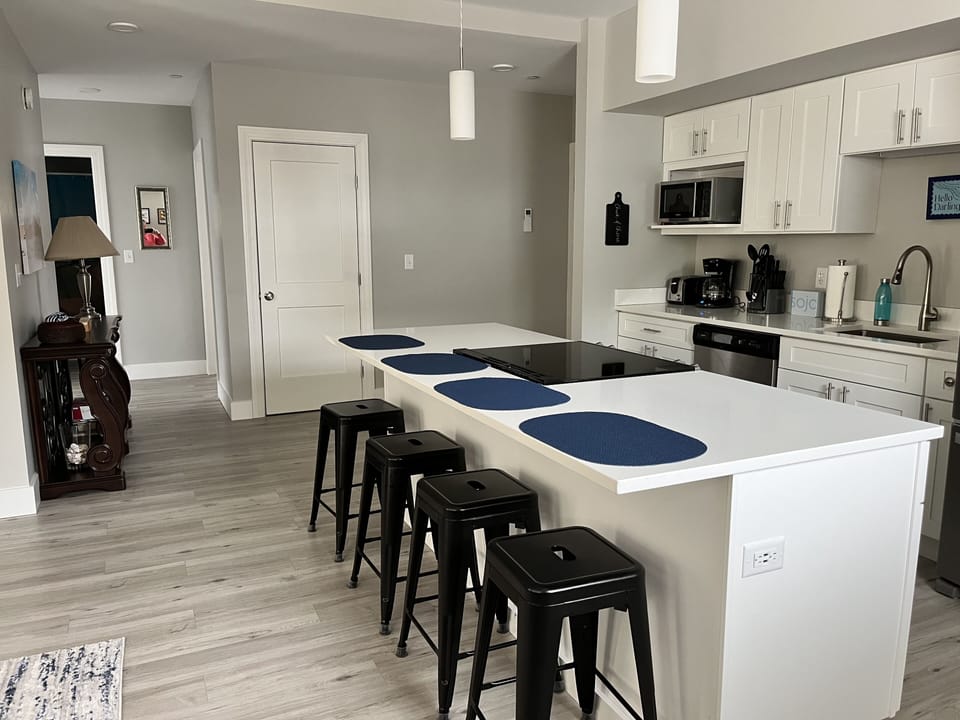 Take a seat at the island to keep the chef company.  Common space is wide open -- everyone can be together.