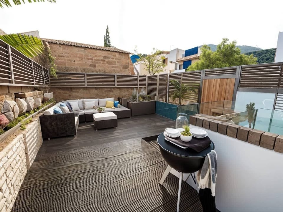 Spacious private patio with outdoor seating, ideal for dining or evening drinks.